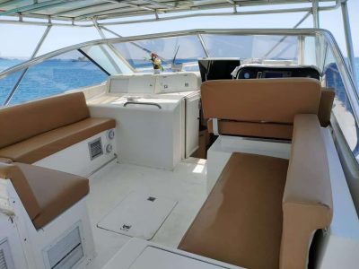Private family boat trip with kids fishing, snorkeling, and enjoying lunch on a sunny island