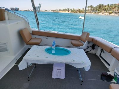 Private family boat trip with kids fishing, snorkeling, and enjoying lunch on a sunny island