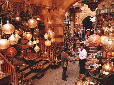 Colorful souvenir stalls and shoppers at Marsa Alam shopping trip