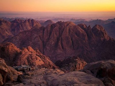 Sunrise view from Moses Mountain Sharm El Sheikh with pilgrims and desert landscape