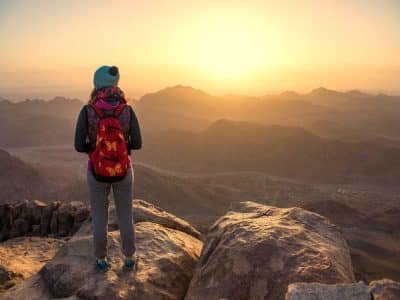 Sunrise view from Moses Mountain Sharm El Sheikh with pilgrims and desert landscape