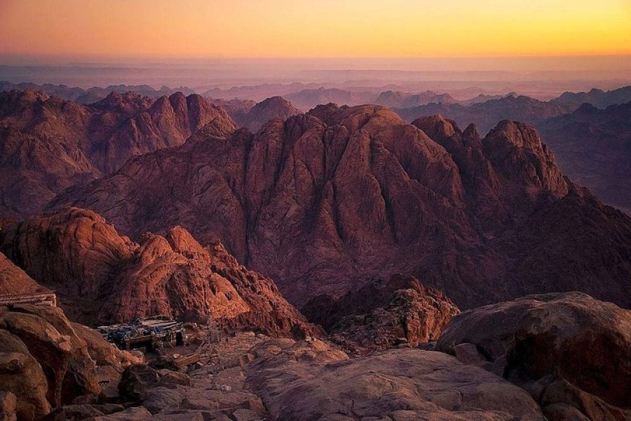 Sunrise view from Moses Mountain Sharm El Sheikh with pilgrims and desert landscape